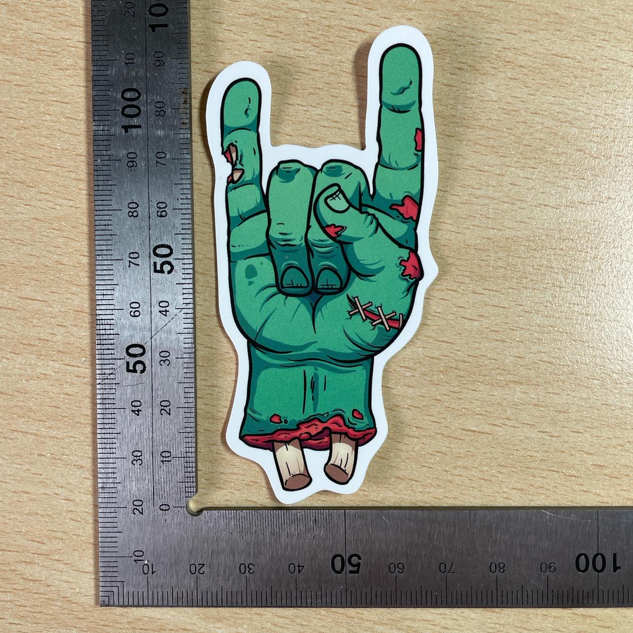 Sticker of a zombie hand with middle finger, #goth #emo