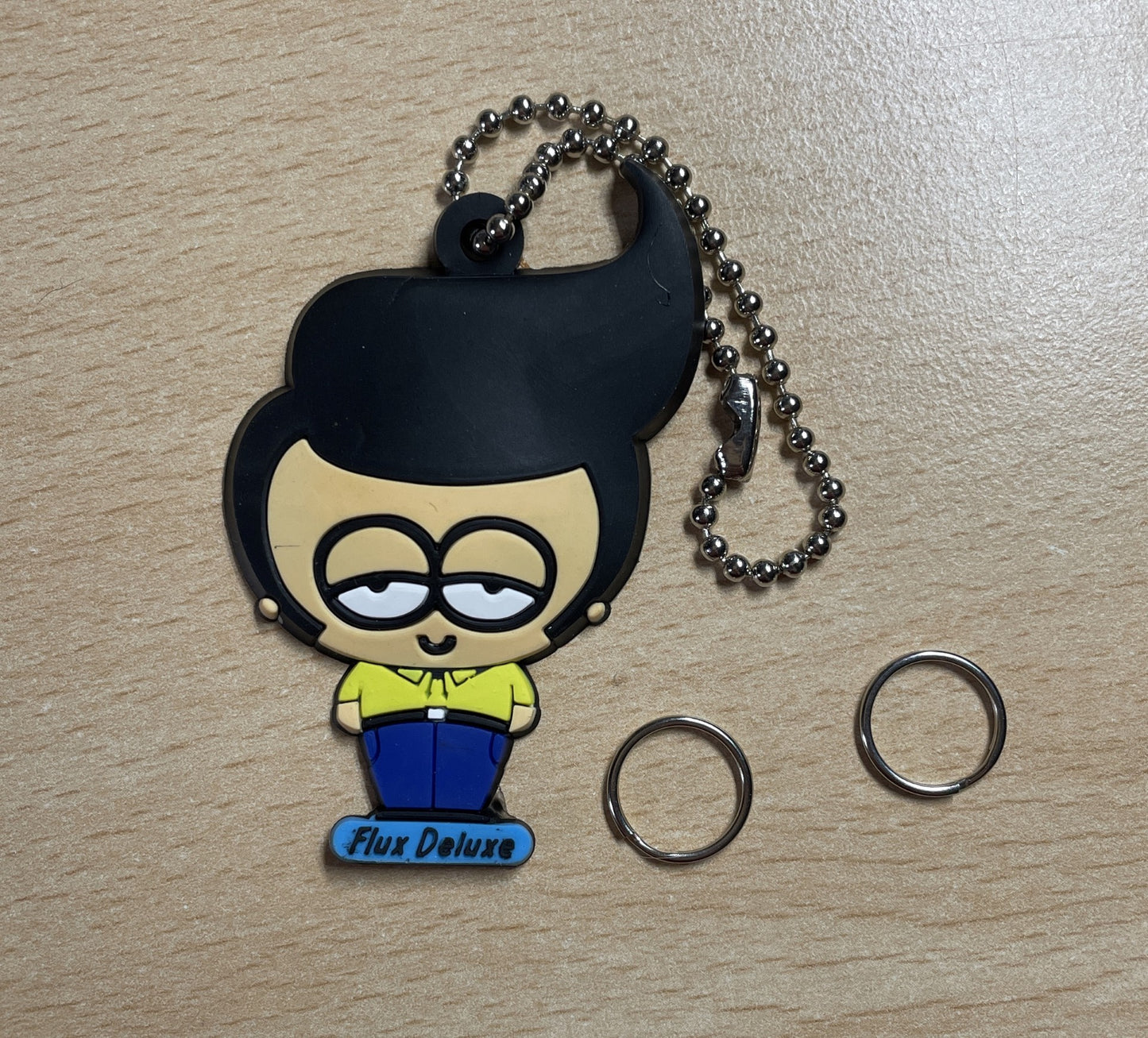 Keychain Charm man with a slicked-back hairstyle