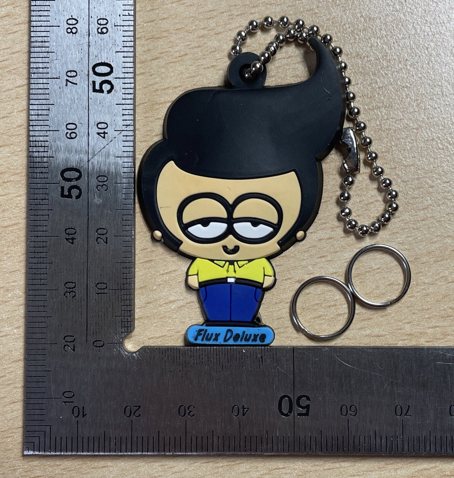 Keychain Charm man with a slicked-back hairstyle