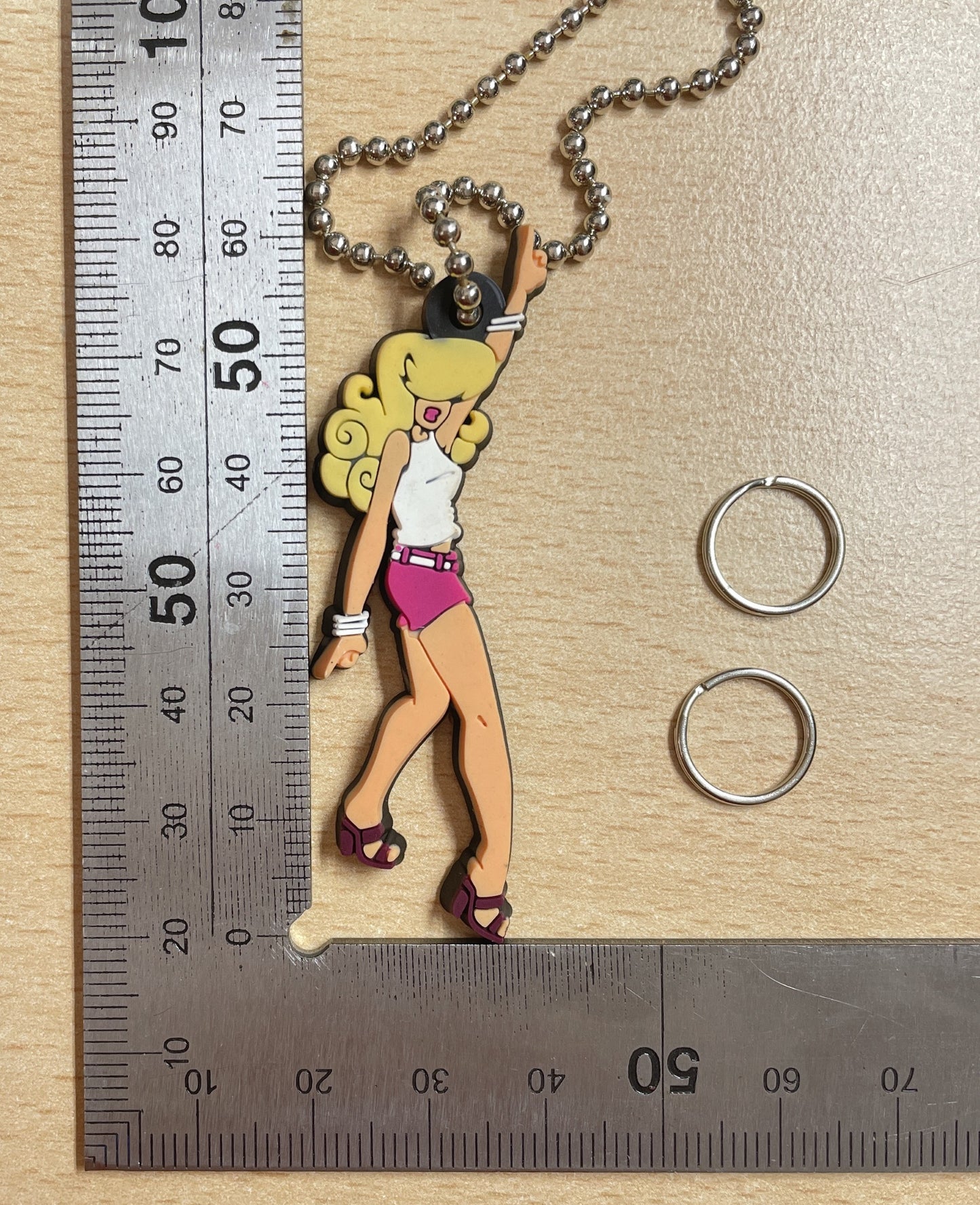 Keychain Charm blonde woman in a white tank top and pink shorts dancing